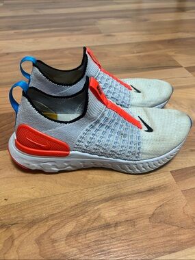 Nike Light Gray Slip-On Running Shoes with Orange and Blue Accents